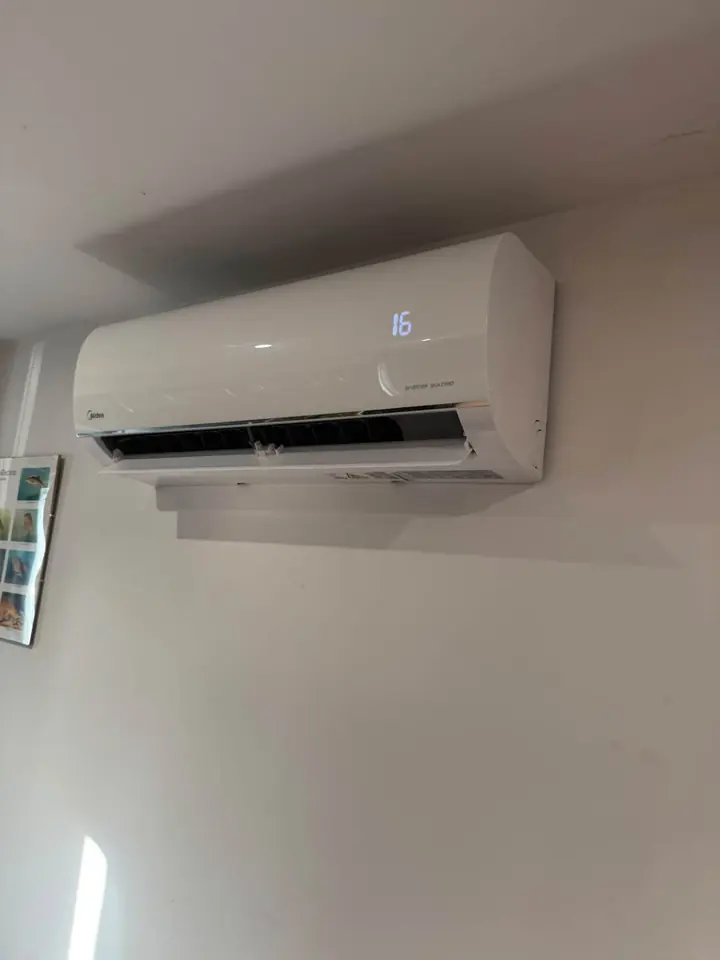 Wall-mounted indoor air conditioning unit displaying 16 degrees